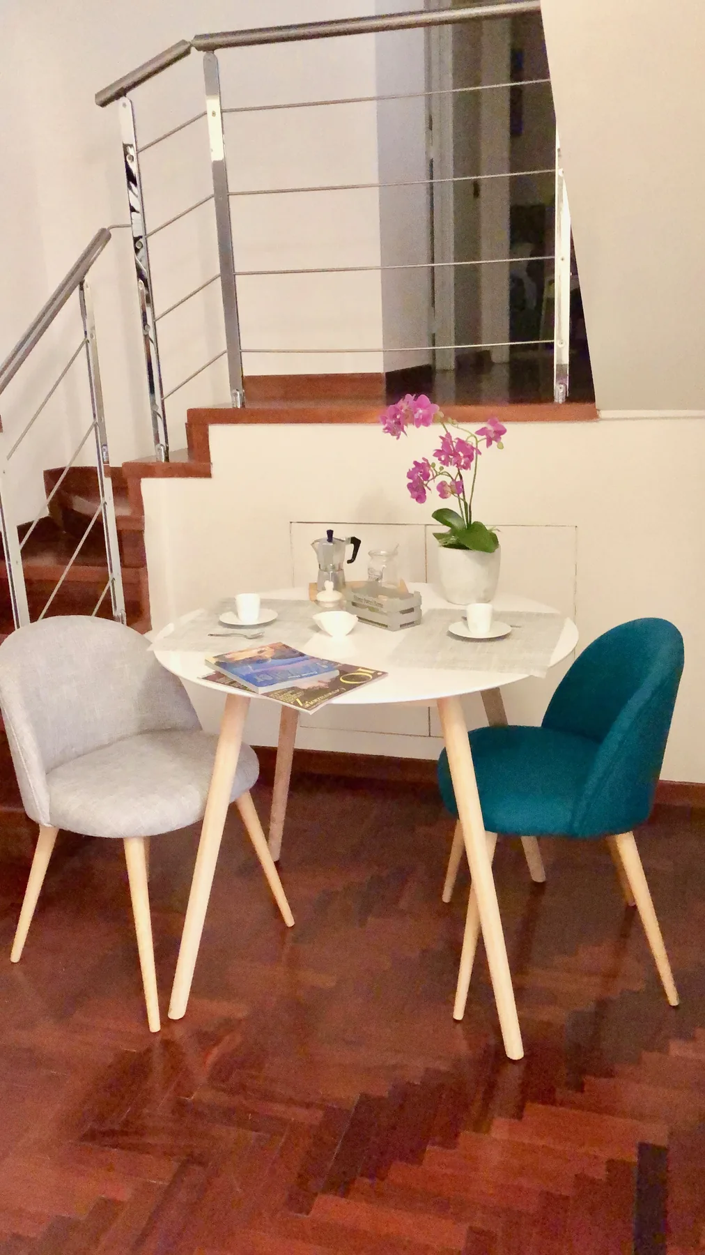 Set dining table beside the staircase